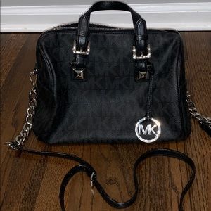 Michael Kors black signature logo handbag.